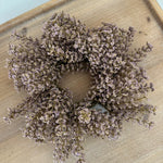 Dried lavender wreath on a wooden surface